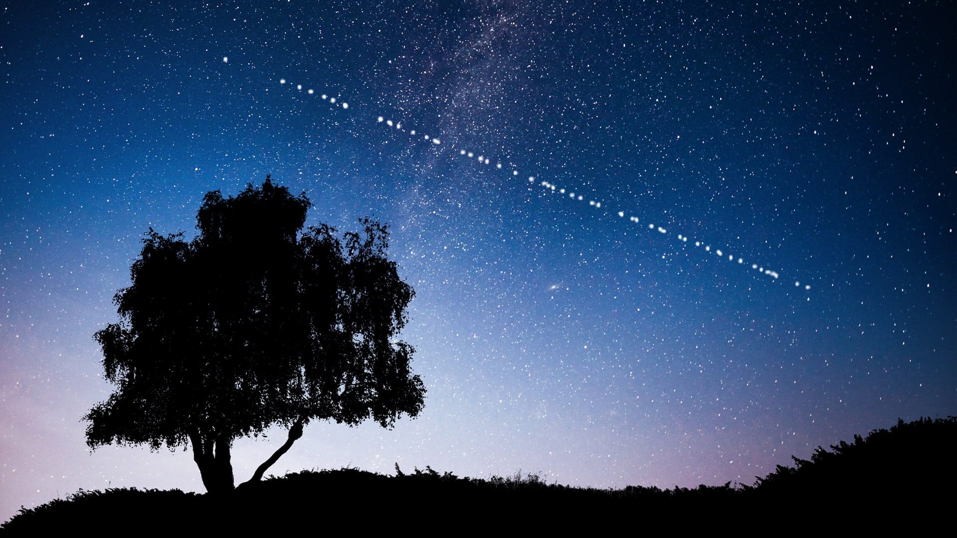 Satellite internet connectivity under a starry night sky, backed by resilient UPS power