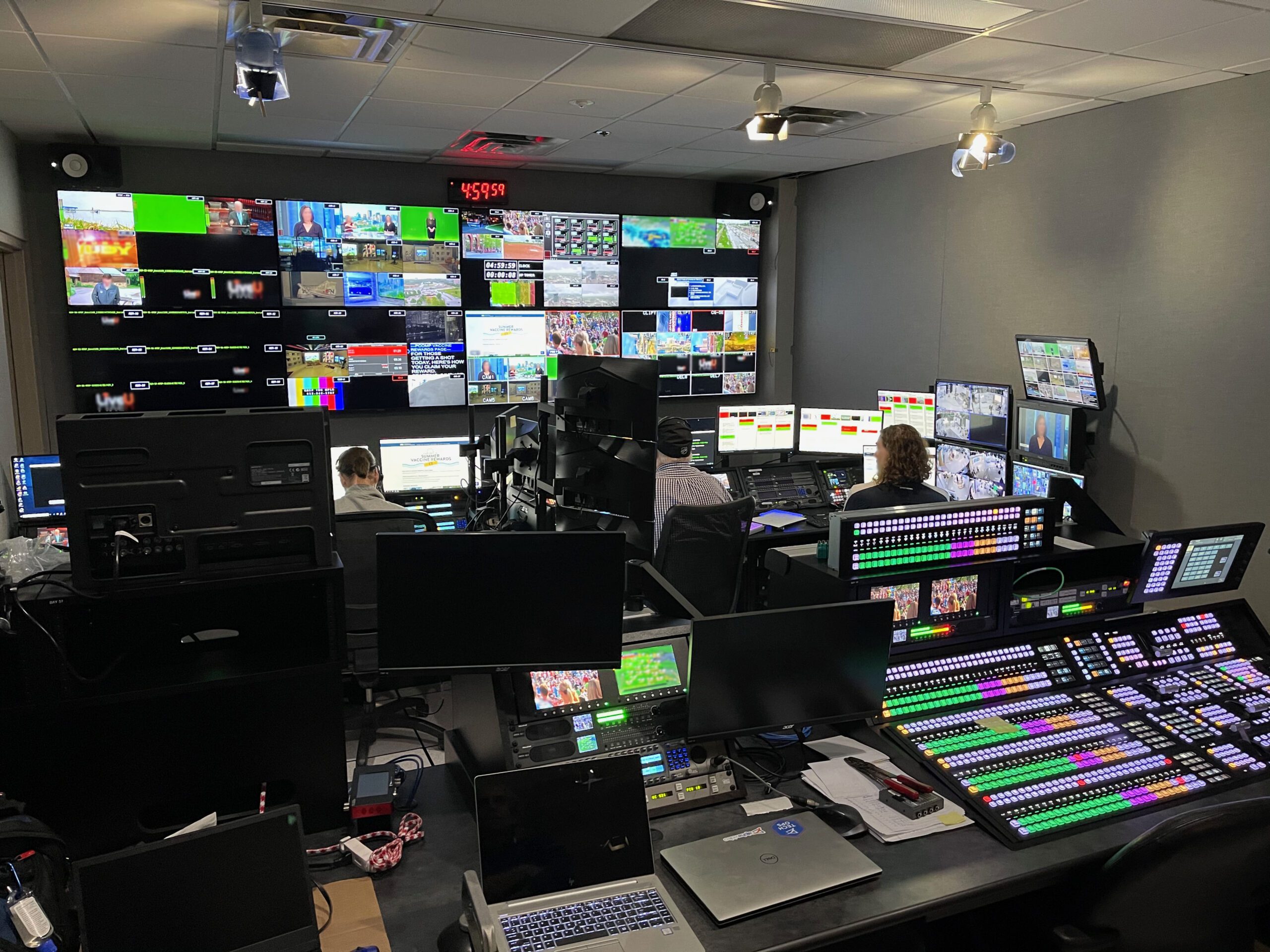 Broadcast control room with a multi-view monitor wall, production switcher, and operators, backed up by an Xtreme Power UPS