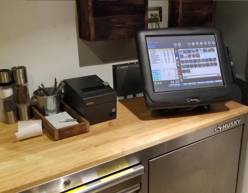 JX Series power conditioner installed behind a restaurant POS station