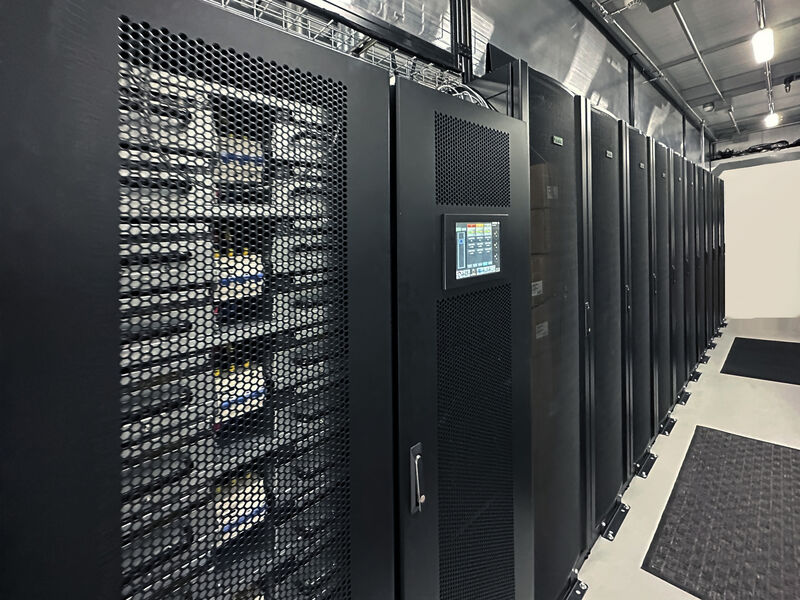 Row of IT racks in a federal data center environment illustrating infrastructure supported by TAA-compliant three-phase UPS systems