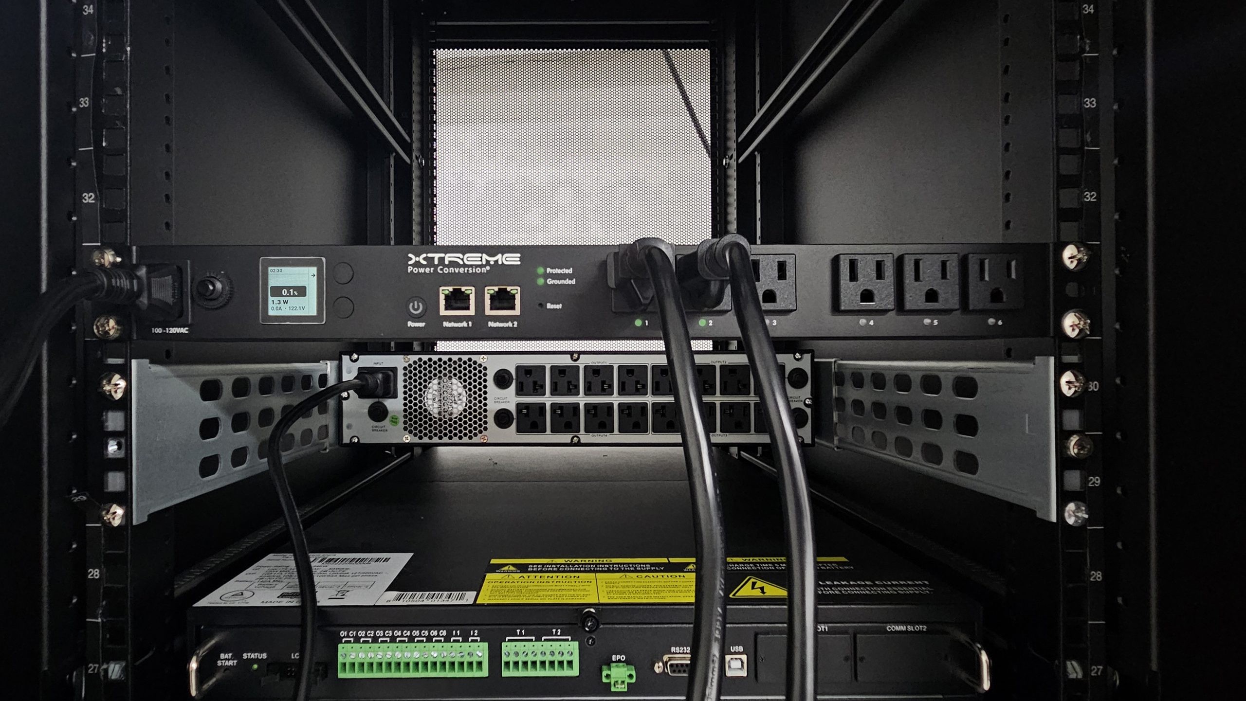 SPDU switched and metered-by-outlet smart PDU installed in a rack — showing outlet-level monitoring and control interface
