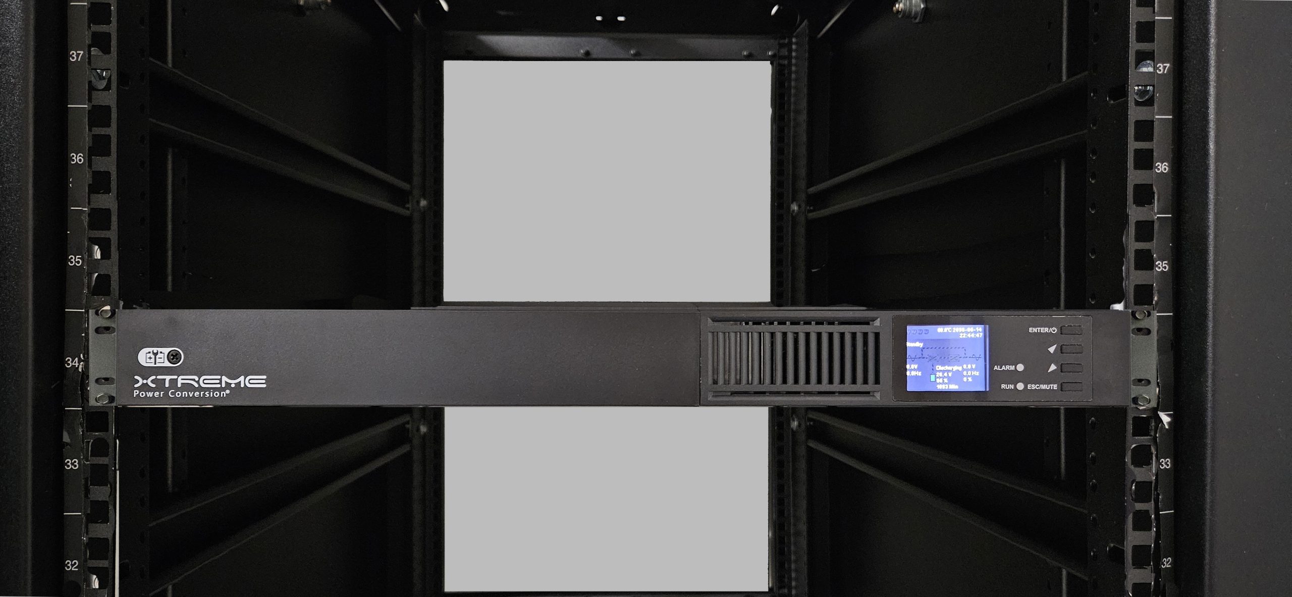 J90 1U online lithium UPS installed in a rack showing LCD display and front panel controls