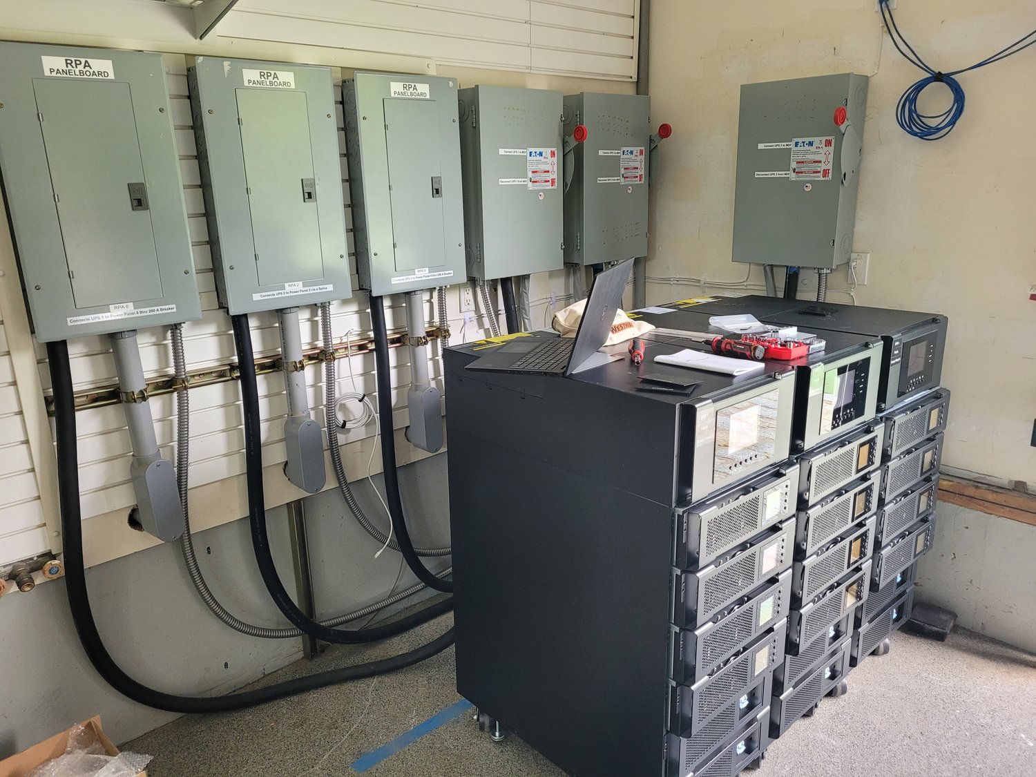 M90S modular UPS systems installed in an electrical room feeding RPA distribution panelboards