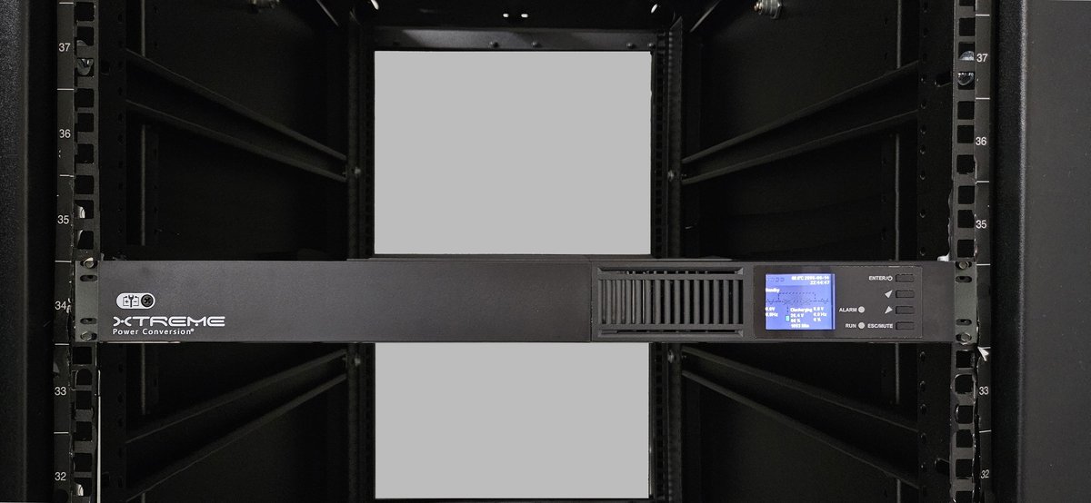 A J90 1U online lithium UPS in an IDF network rack with switches and structured cabling